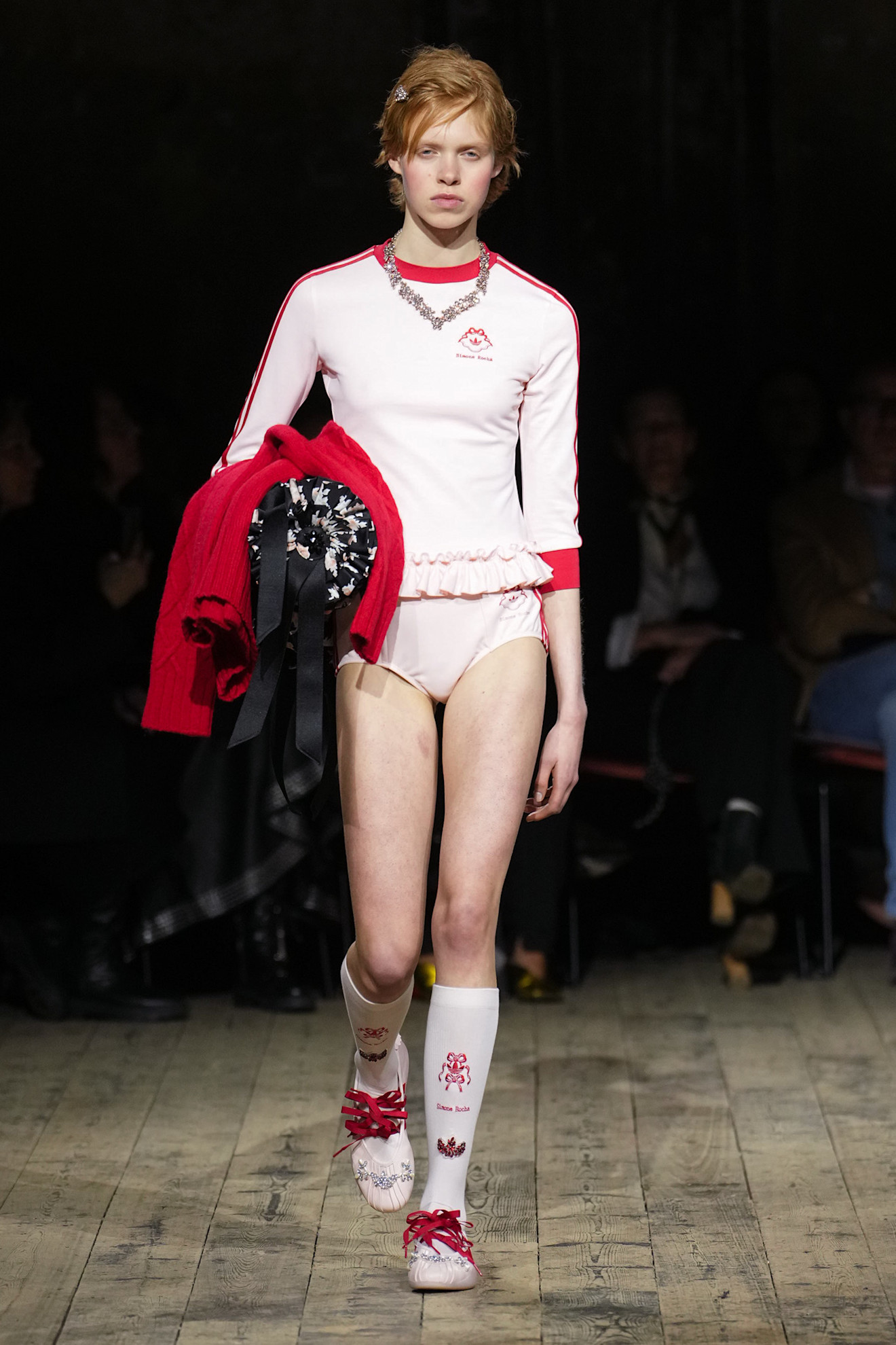 a model on the simone rocha runway wearing a longsleeve shirt and socks from the Simone Rocha Adidas collaboration