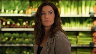Cobie Smulders standing in a grocery story in The Lincoln Lawyer. 
