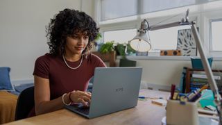 Dell XPS 13 laptop being used by a student sat at a desk