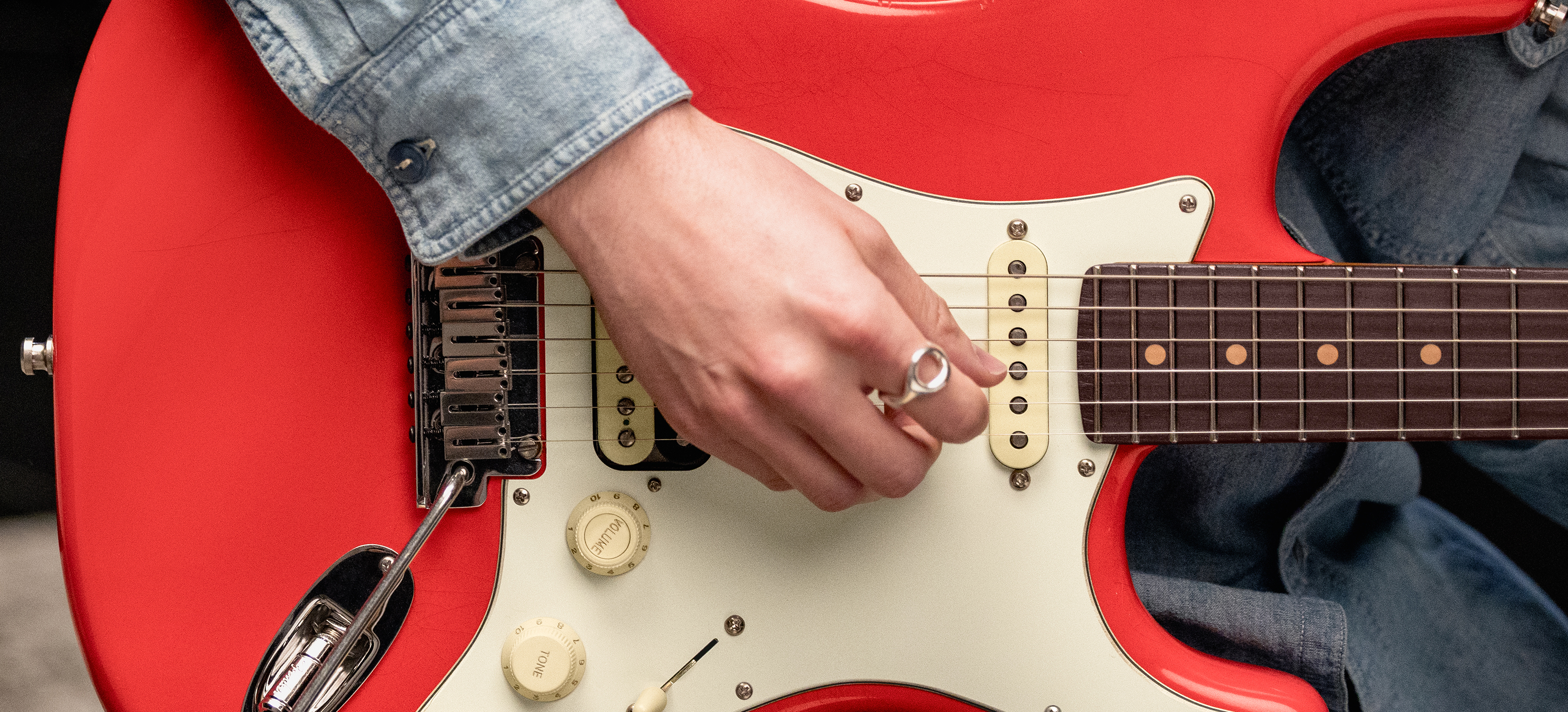 A photo of the Fender American Ultra Luxe Vintage &rsquo;60s Stratocaster HSS in Fiesta Red