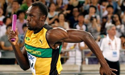 Usain Bolt of Jamaica sprints to the finish line to win the men's 4x100 meter relay at the World Championships in September 2011, where he set a new world record of 37.04 seconds.