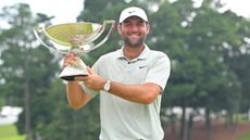 Scottie Scheffler holds the FedEx Cup trophy