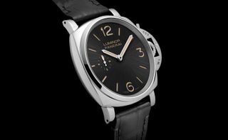 Panerai’s ’Due’ watch with a black face, silver hands and rim.