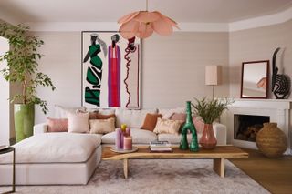 Living room with pink lighting and pale pink walls