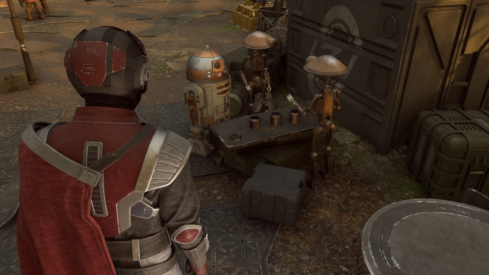 A pit droid prepares to swindle two other droids with the shell game
