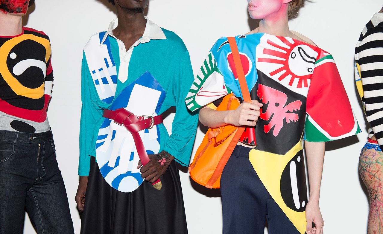 Models backstage wearing various curated outfits