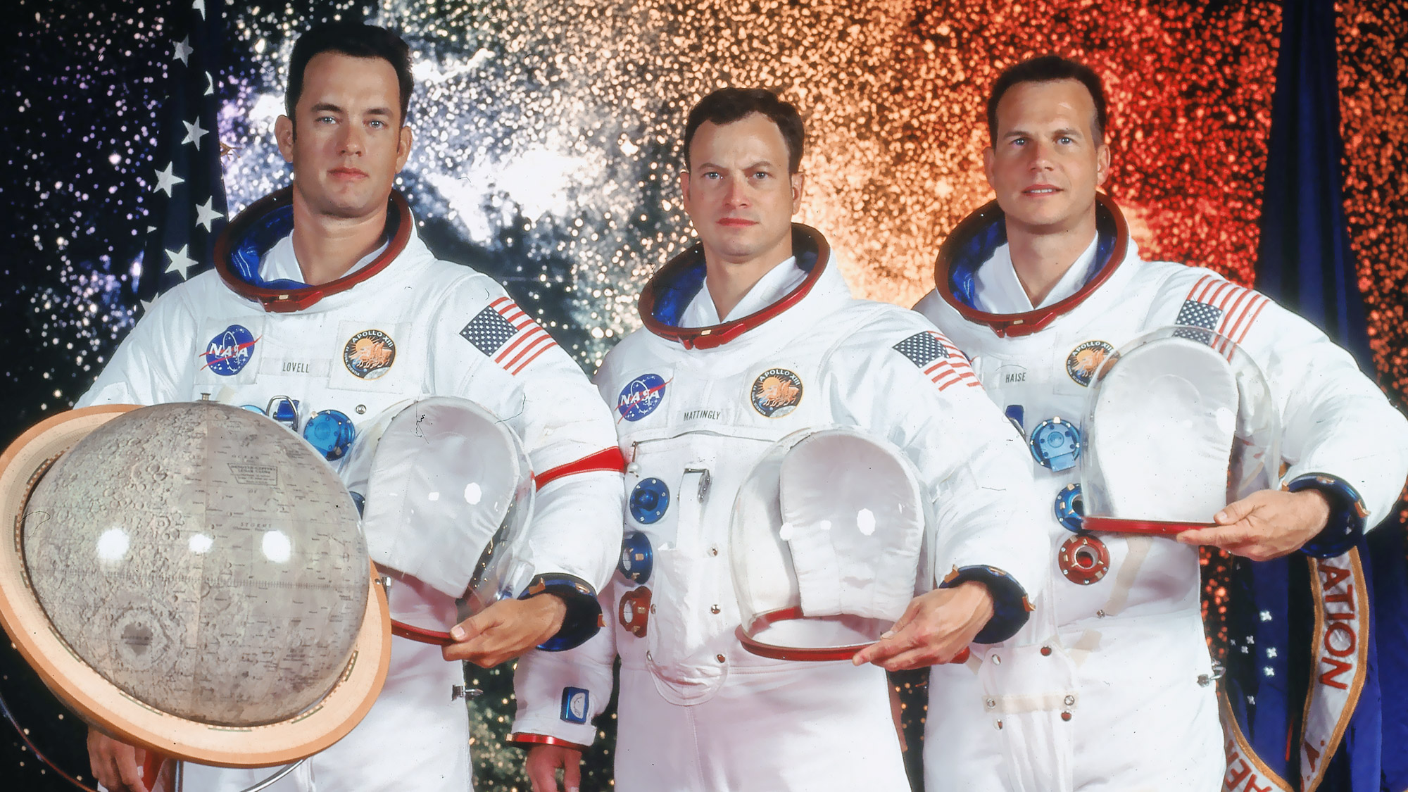 Three Apollo-era astronauts in spacesuits