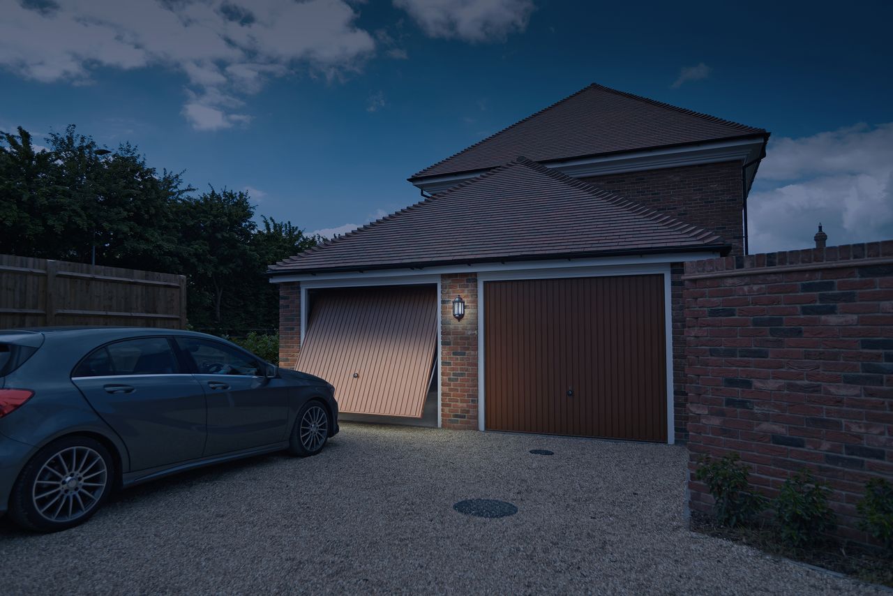 garage door being opened at dusk