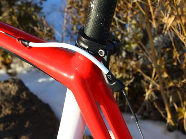 The rear brake housing stop is integrated into the seatpost collar.