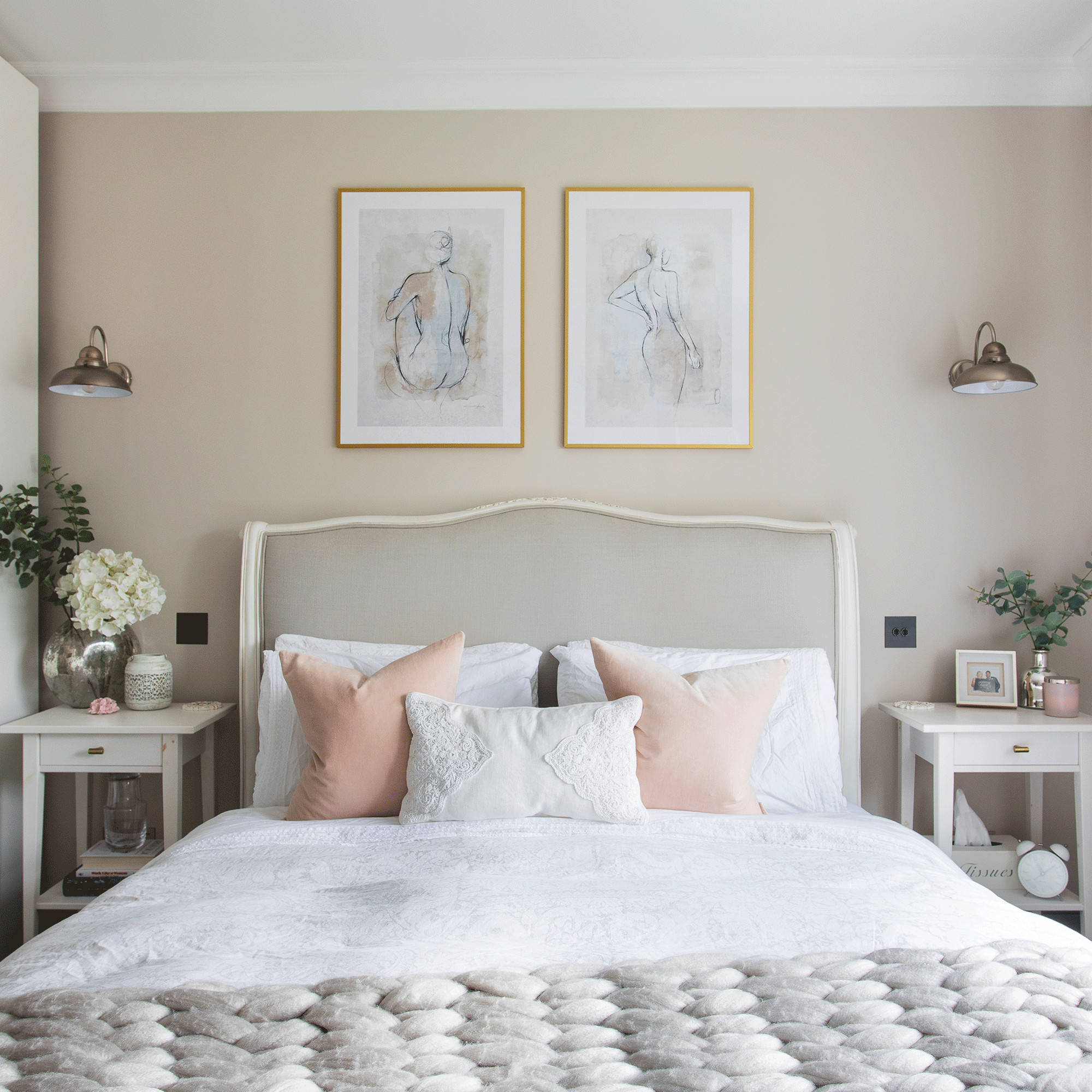 Taupe bedroom with white bed and artwork