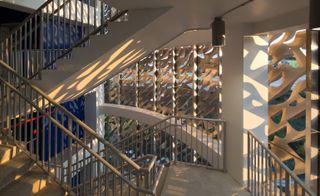 Interior view of the Leong Leong building, stairwells, light shining through the external design casting patterns on the inside