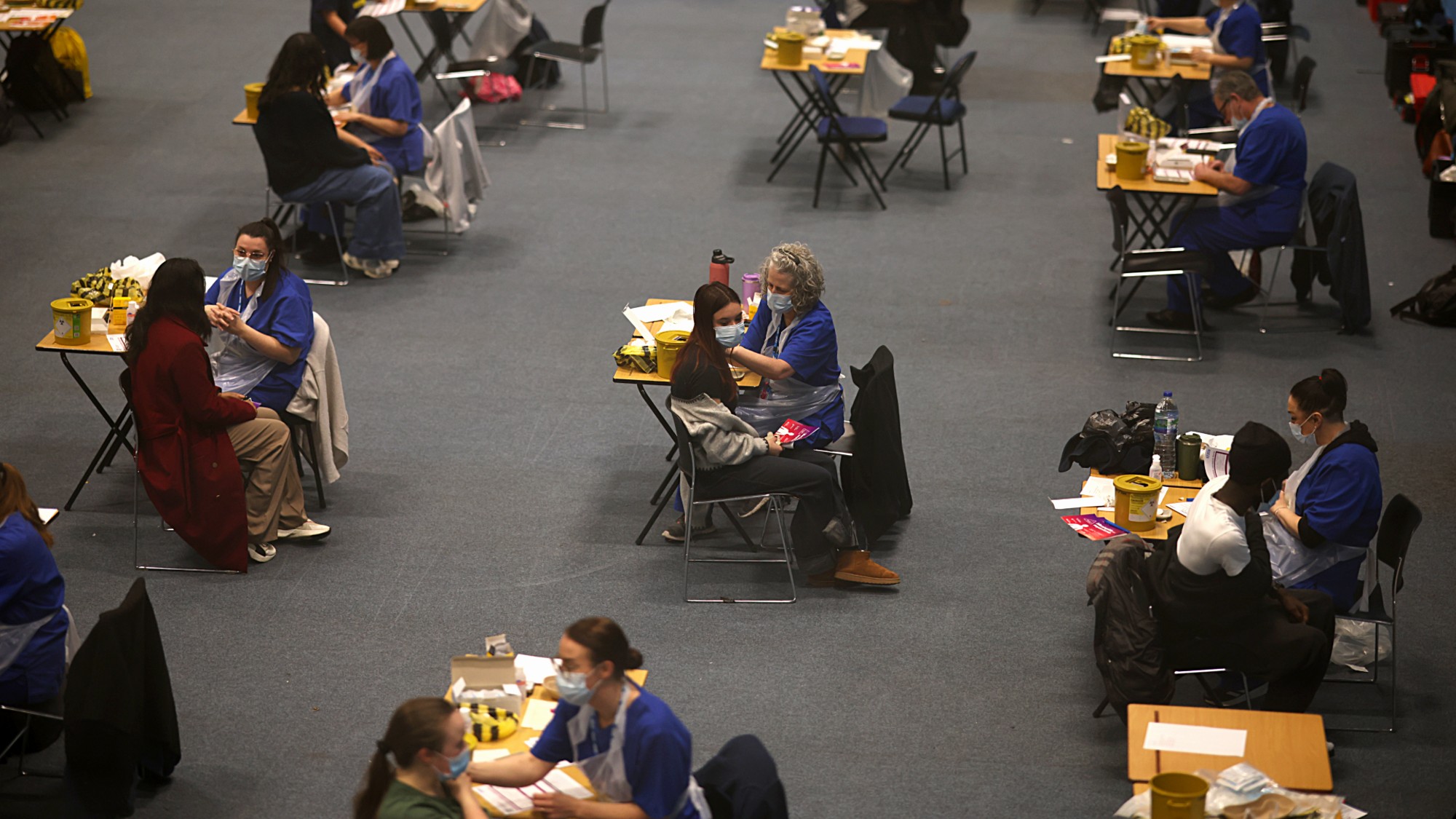 Students receive the Meningitis B vaccine in the University of Kent sports hall