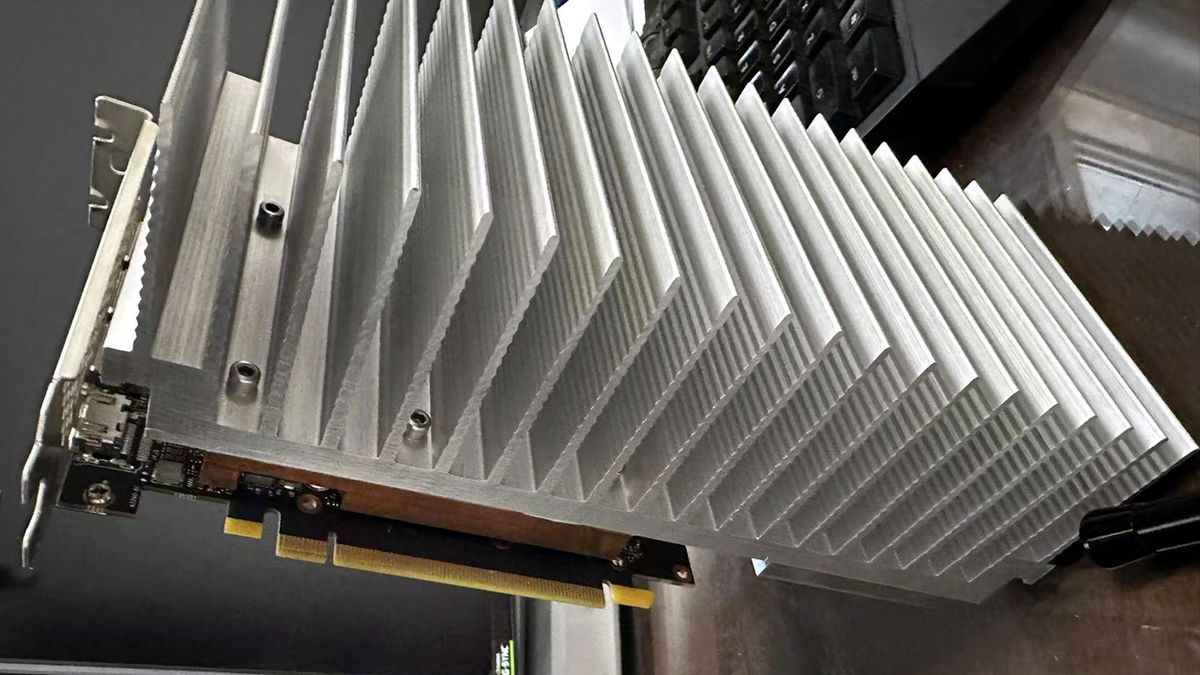 PC modder bolts 5.5-pound aluminum heatsink to RTX 4060 — convection-only cooling seems to work fine in a testbench-style installation