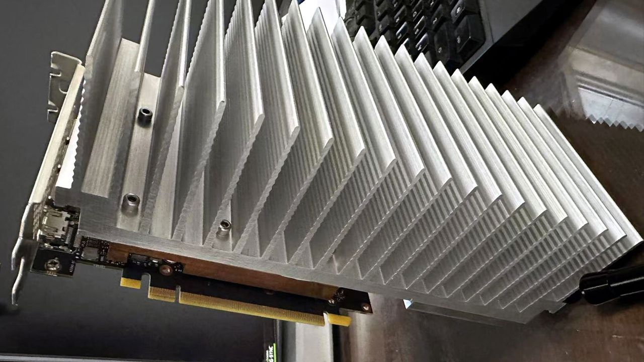 PC modder bolts 5.5-pound aluminum heatsink to RTX 4060 — convection-only cooling seems to work fine in a testbench-style installation