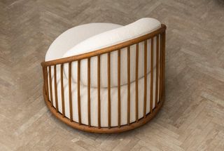 Inspired by 1970s furniture, round chair with wooden slatted back and white upholstery, by Expormim and Norm Architects
