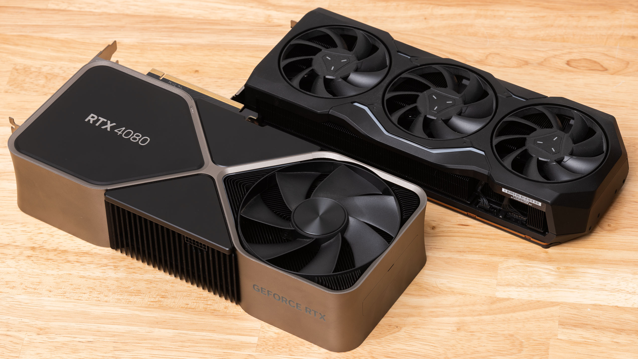 A GeForce RTX 4080 and Radeon RX 7900 XTX side by side