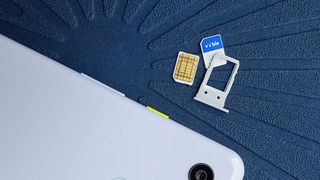 Visible SIM card next to Pixel 3a
