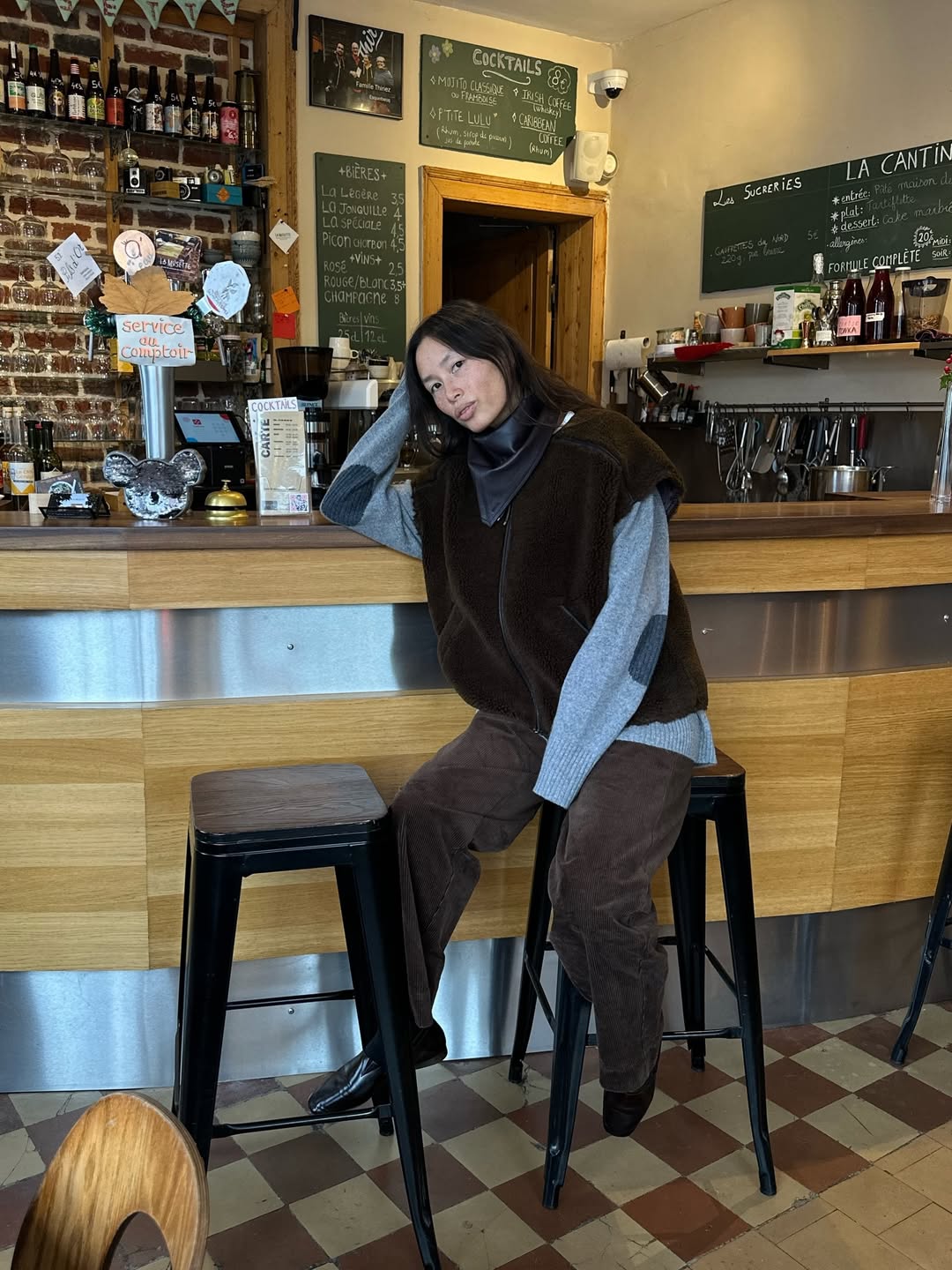 Influencer Anne-Victoire Lefevre wearing a borg filet over knitwear.