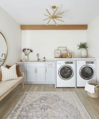 laundry room with brass accessories