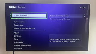 The Roku System screen with the Screen Mirroring option selected (and highlighted in a green box) on the left side of the screen, the third step for Roku screen mirroring.