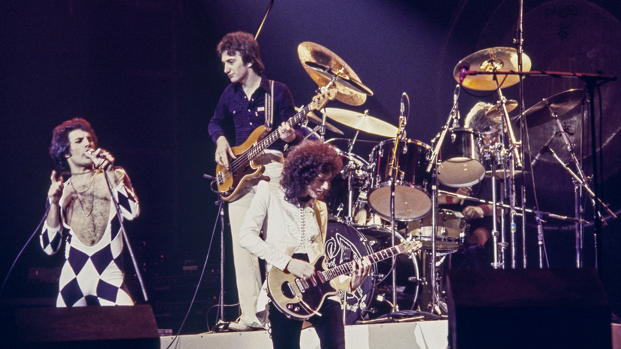 (MANDATORY CREDIT David Tan/Shinko Music/Getty Images) British band Queen, Freddie Mercury, John Deacon, Brian May, Roger Taylor, on stage at the Veterans Memorial Coloseum on the 'News Of The World' tour, New Haven, Connecticut, United States, 16th November 1977.
