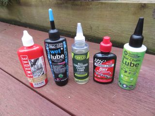 Finish Line Dry Lube next to other bike chain lubes we've tested and reviewed