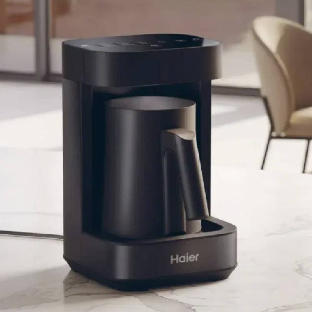 A matte black Haier coffee maker.