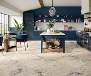 large blue Shaker kitchen with stone-effect porcelain large format floor tiles