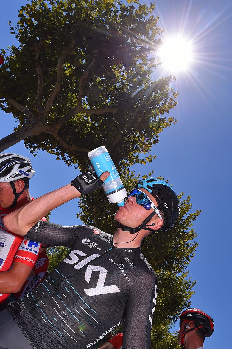 Chris Froome gets some refreshment before the start