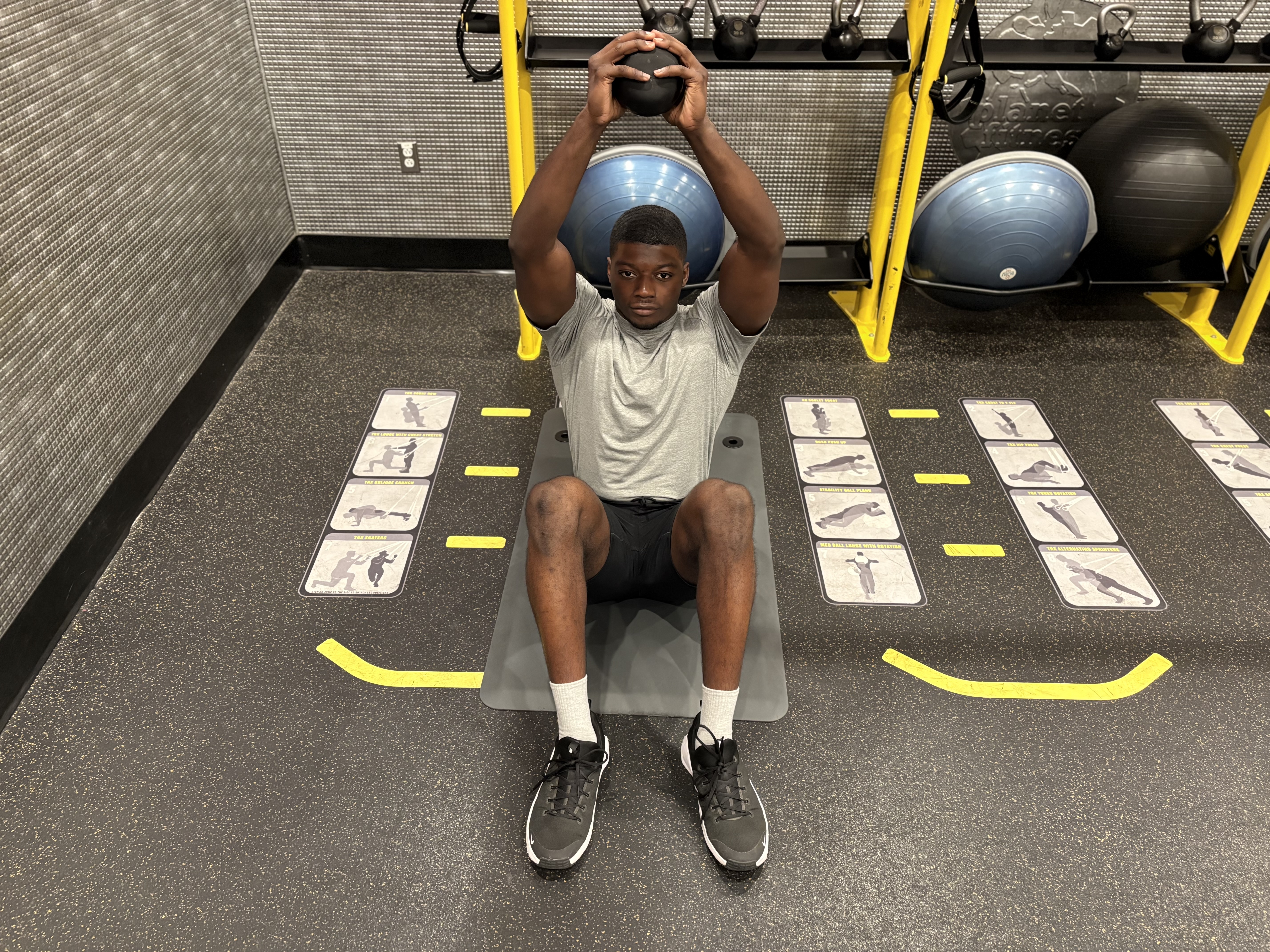 Man exercises with kettlebell in gym