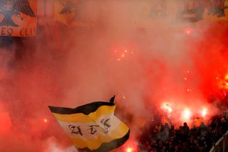 AEK Athens fans with flares in a match against Olympiacos in February 2012.