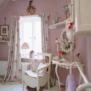 washroom with pink wall white chair shelf window