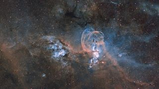 Ignacio Diaz Bobillo captured this image of two nebula complexes, far apart from one another. It was captured with a Astro-Physics 167mm apochromatic refractor telescope at f/7.2, Astrodon SII, H-alpha and OIII 3mm filters, Astro-Physics 1100GTO mount, Apogee Atlas U16M cameras, narrowband, SII-Ha-OIII composite, 16-hour total exposure.