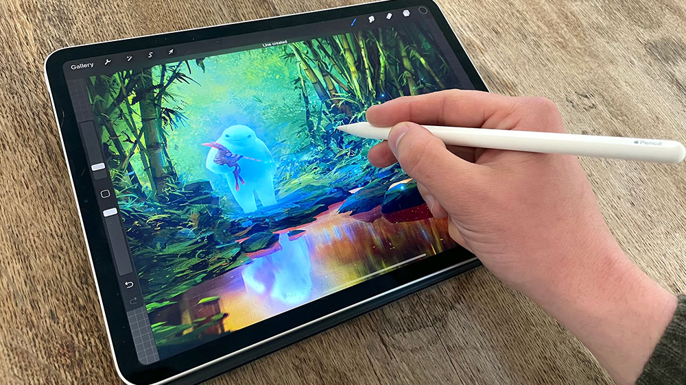 A person using an Apple Pencil to draw on an iPad.