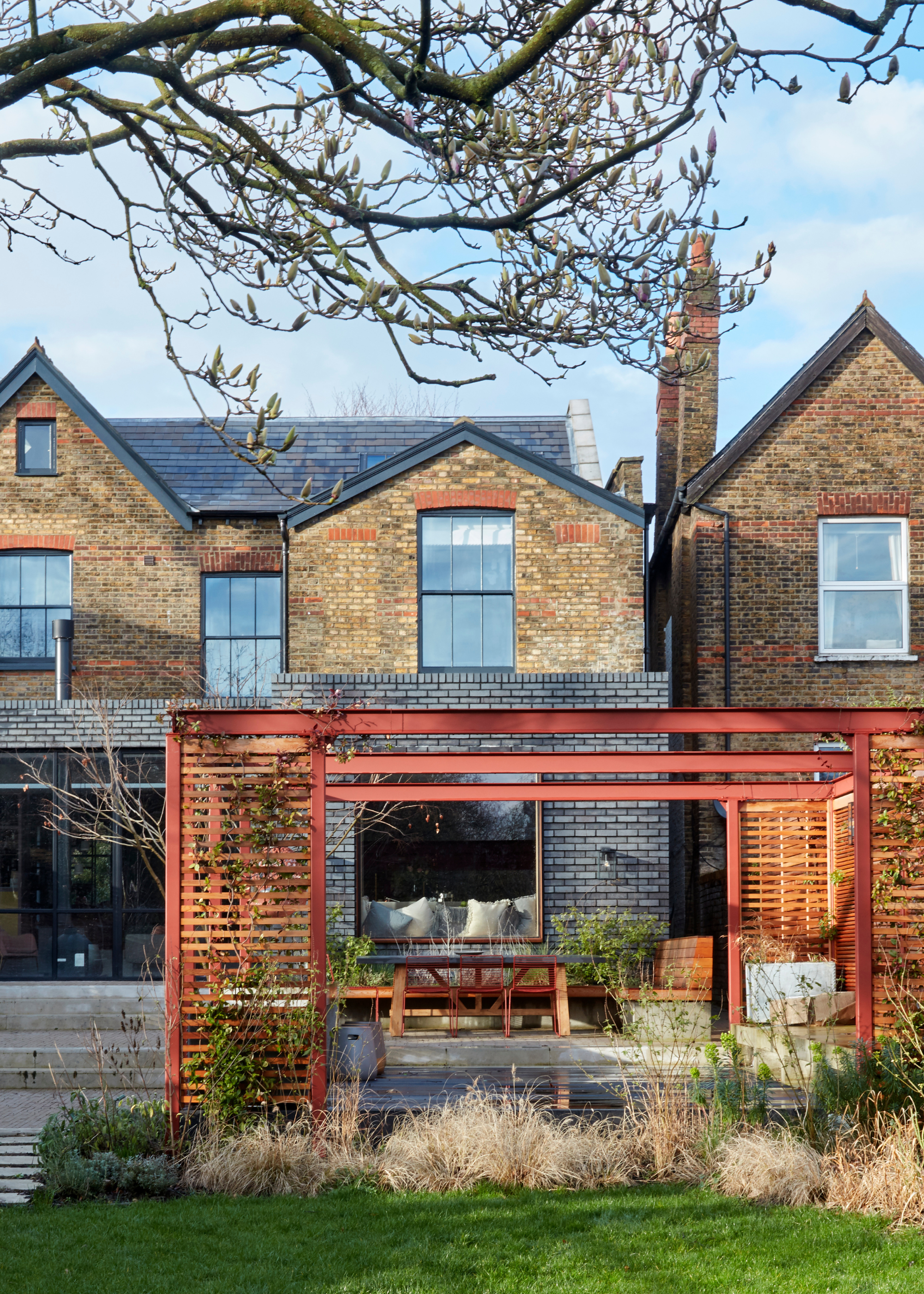 red cast concrete structure in the exterior of a terraced house