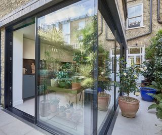 kitchen extension with two glazed walls including large sliding patio doors