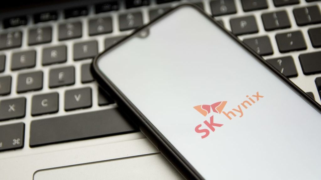 SK Hynix logo displayed on a smartphone sitting on a laptop&amp;#039;s keyboard