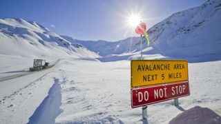 Avalanche sign at the base of Atigun Pass on the James Dalton Highway, Alaska.