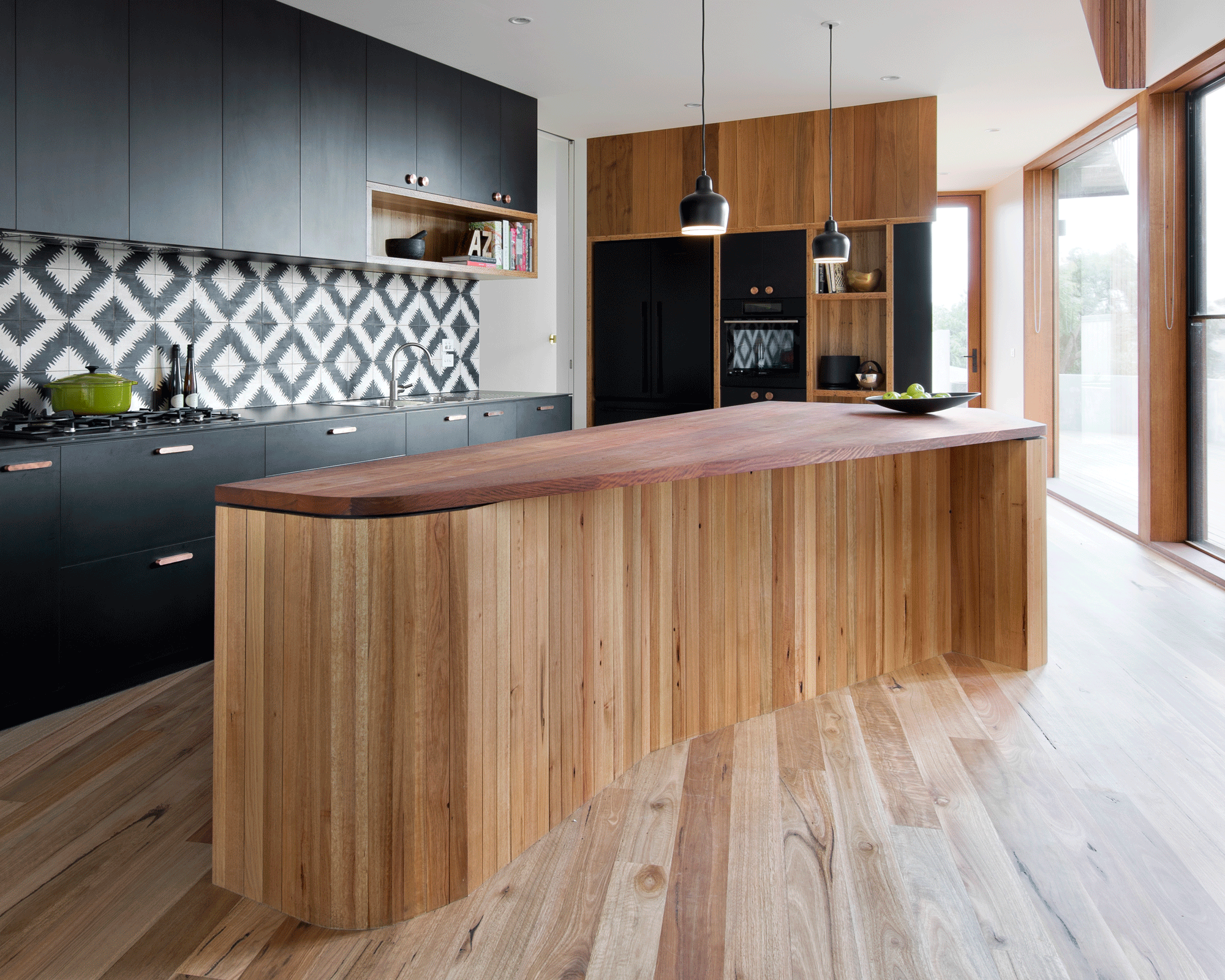 Wavy kitchen island made of wood