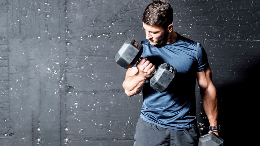 Man performing.a dumbbell bicep curl