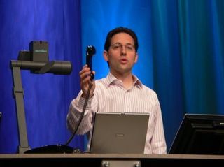 Microsoft's corporate vice president for the Information Worker Product Management Group (try fitting that on a business card), Chris Capossela, demonstrates one of the new devices with which one can use the upcoming edition of Outlook. By means of a new