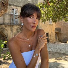 @juliesfi wearing a white dress on holiday