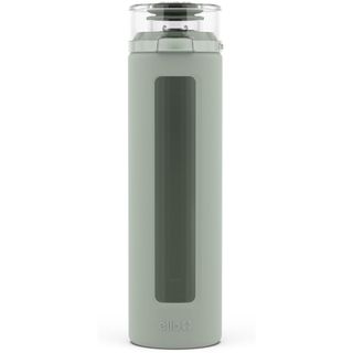 A green glass water bottle