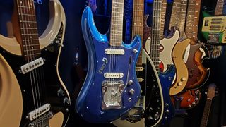 A collection of 1960s Japanese guitars, with a blue Guyatone LG 350-T "Sharp 5" at the center