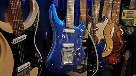 A collection of 1960s Japanese guitars, with a blue Guyatone LG 350-T "Sharp 5" at the center