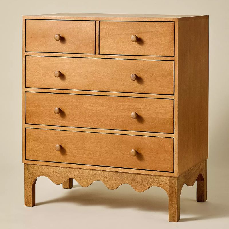 wooden dresser with wavy bottom edge