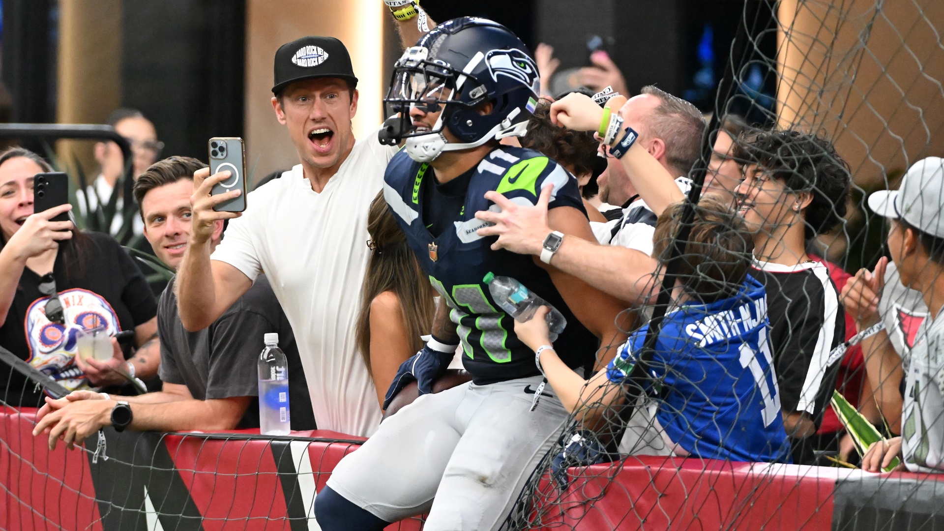Seattle Seahawks wide receiver Jaxon Smith-Njigba celebrating with fans