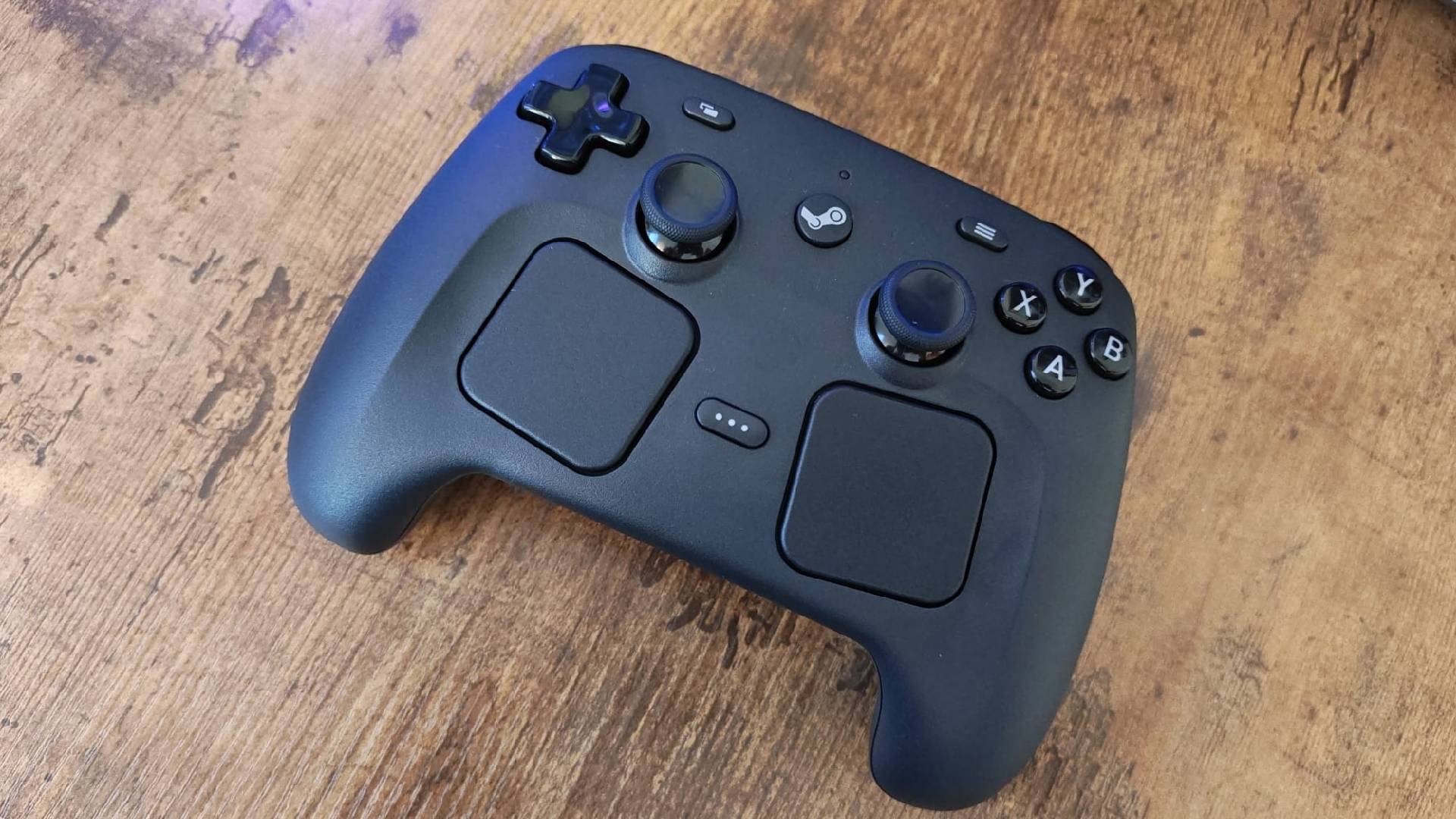 Steam Controller sitting at an angle on a woodgrain desk.