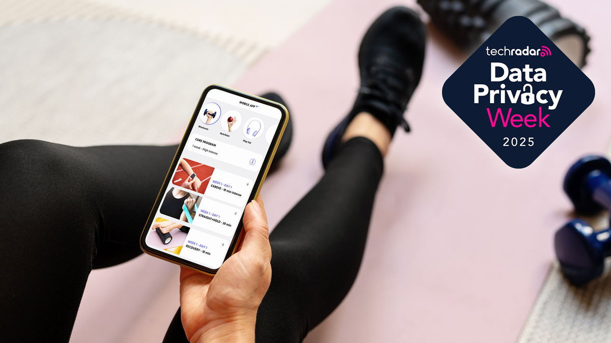 Photograph of a woman in workout gear sat on a yoga mat whilst using a smartphone to check out a fitness app