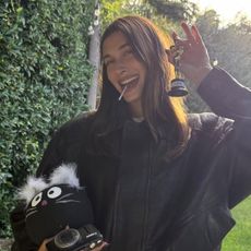 Hailey Bieber wears Gap jeans and a Saint Laurent bomber jacket at Bella Hadid's birthday party